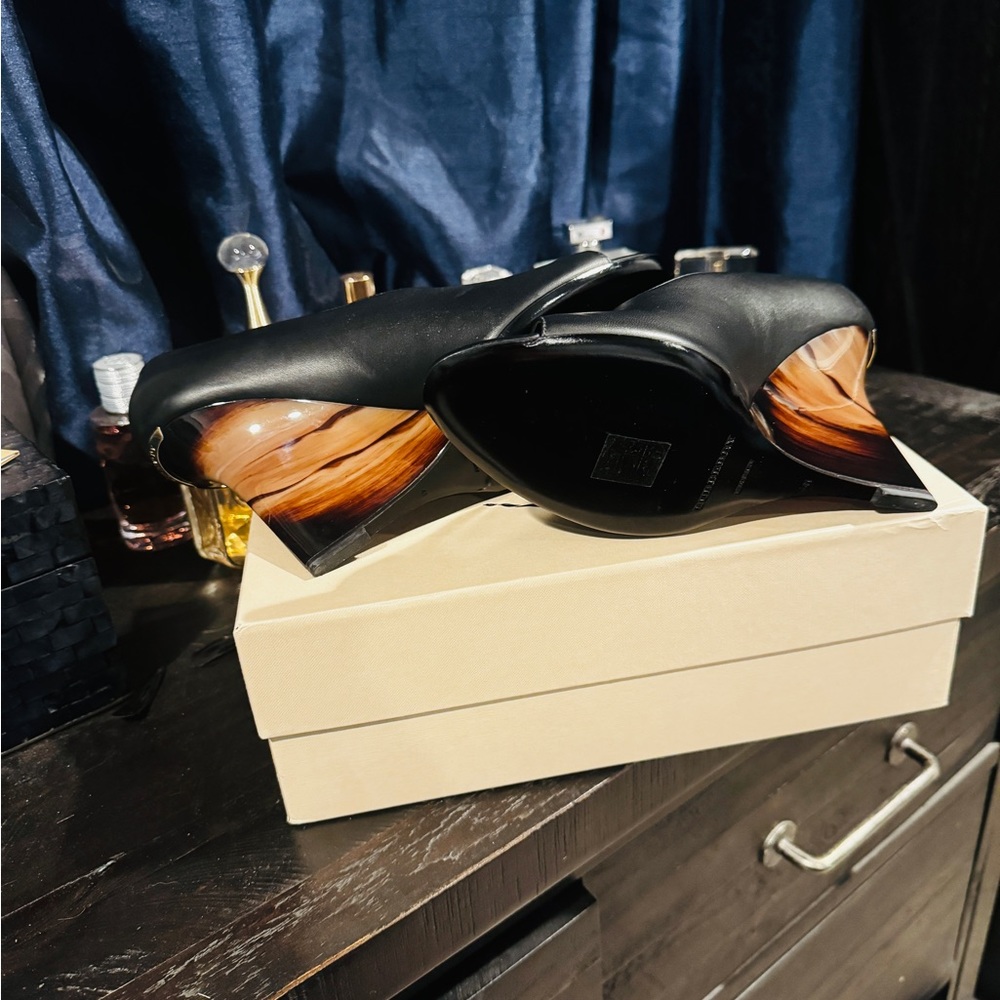 BURBERRY Wedges in Black & Brown features an open toe a 4″ wedge.